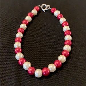 Glass beaded bracelet.  Red and ivory beads